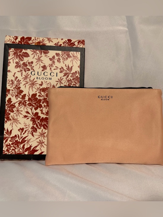 Gucci Handbags - Gucci Bloom pink satin zippered pouch / cosmetic bag. New in box